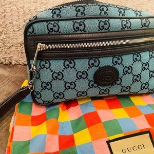 Authentic Gucci monogram navy/light blue belt clutch.